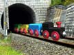 Busy Little Engine comes out of a tunnel